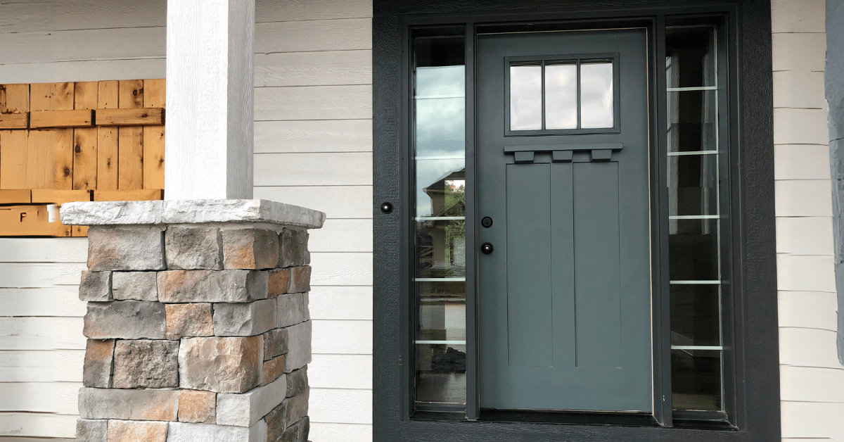 Dark matte green front door.