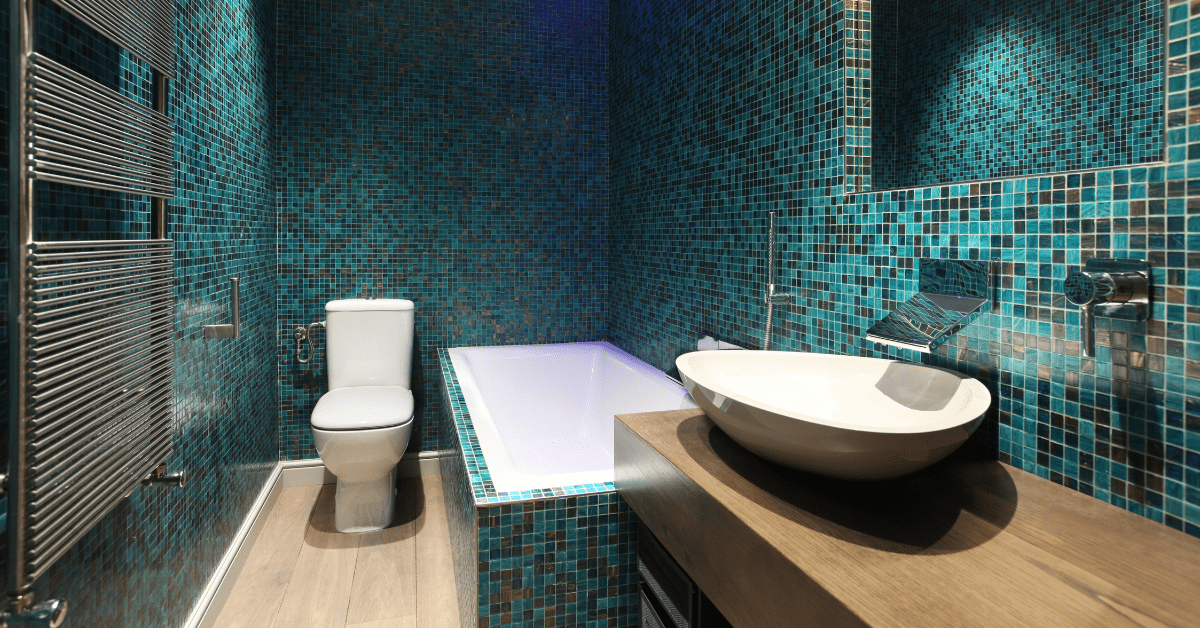 Green mosaic tile in bathroom.