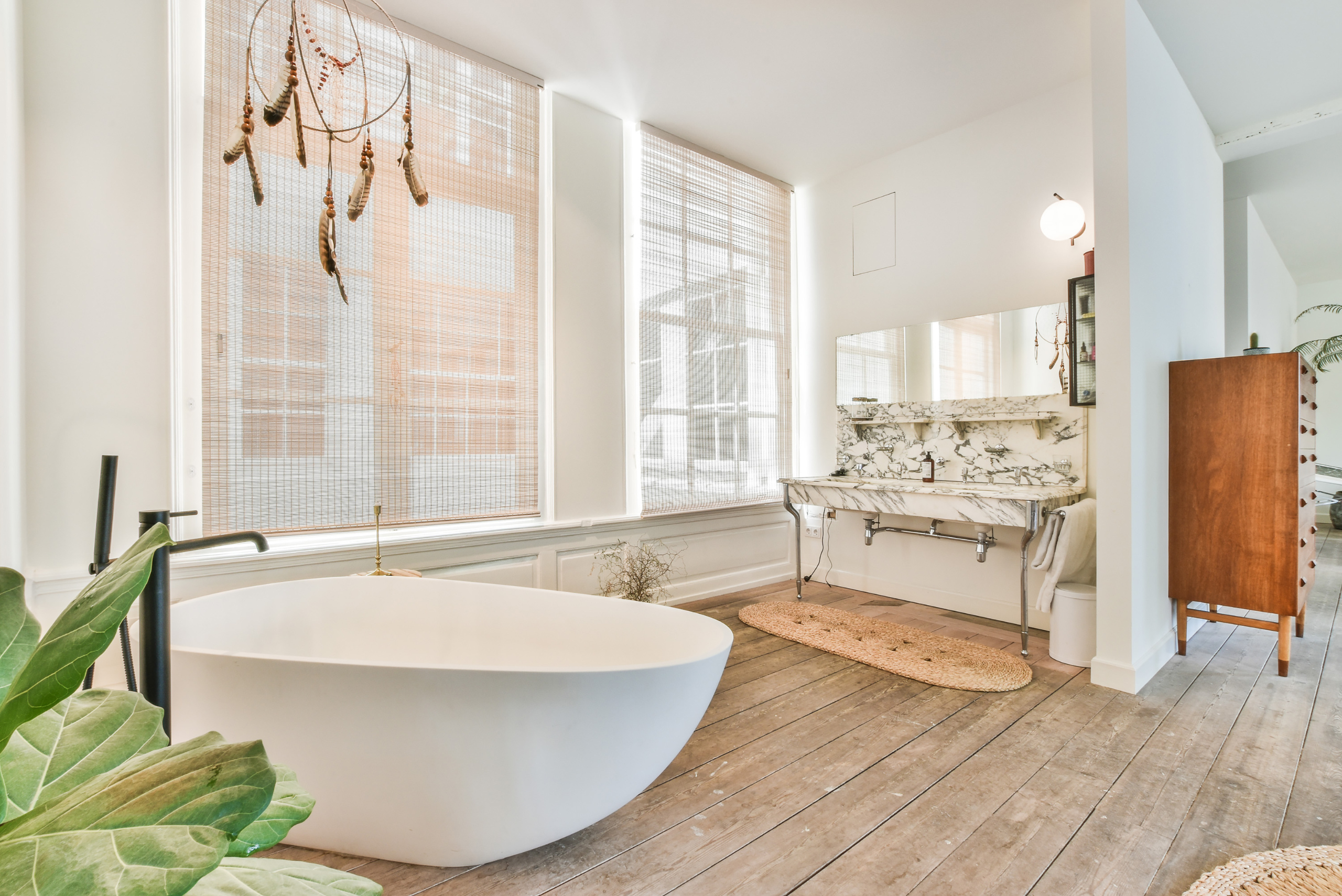 Luxurious bathroom with large white soaking tub.