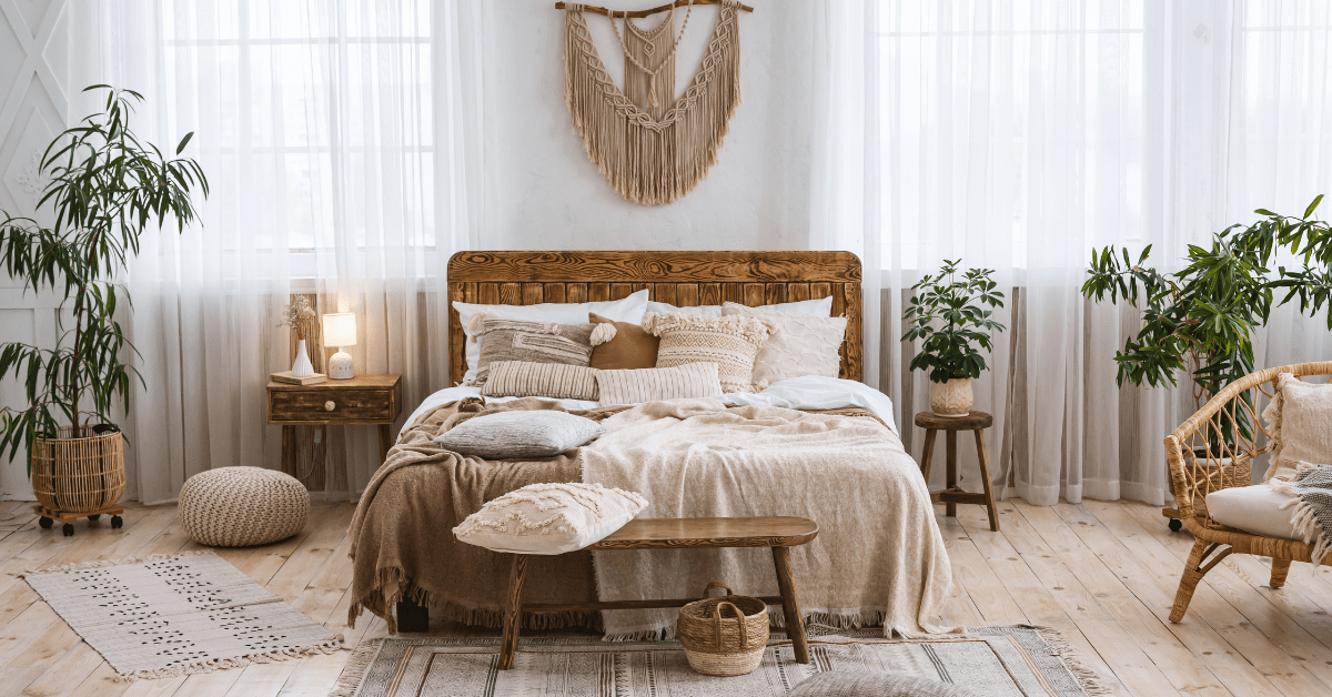 Bed with art above it in a bohemian style.