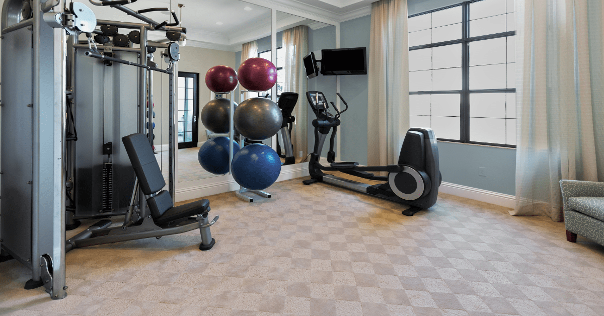 Home gym with assortment of equipment.