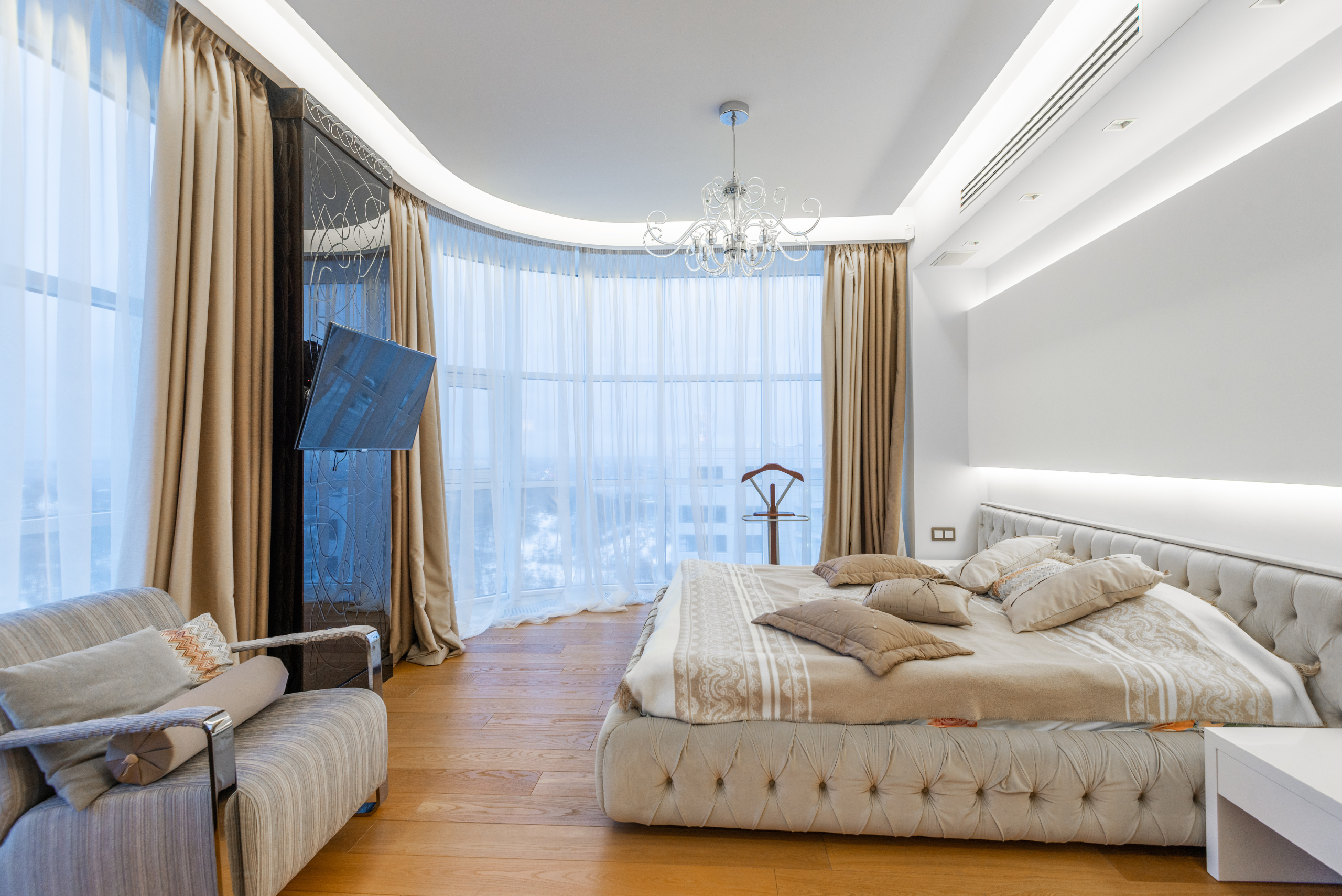 Bedroom with various luxurious finishes.