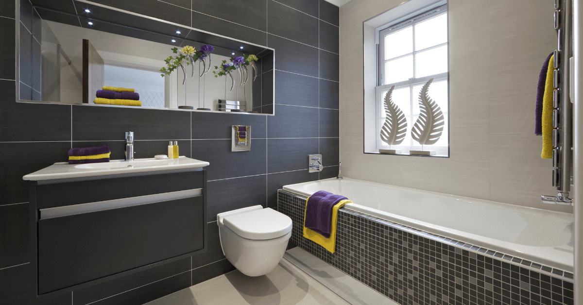 Bathroom with mosaic tile on the bathtub.