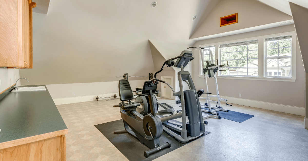 Exercise equipment in a home gym attic.