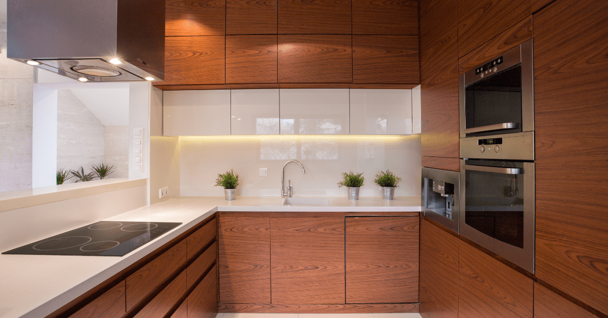 Modern kitchen with luxurious wooden cabinets and lights.