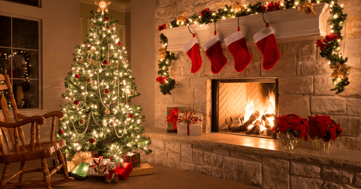 Christmas decorations around the mantel of a fireplace.