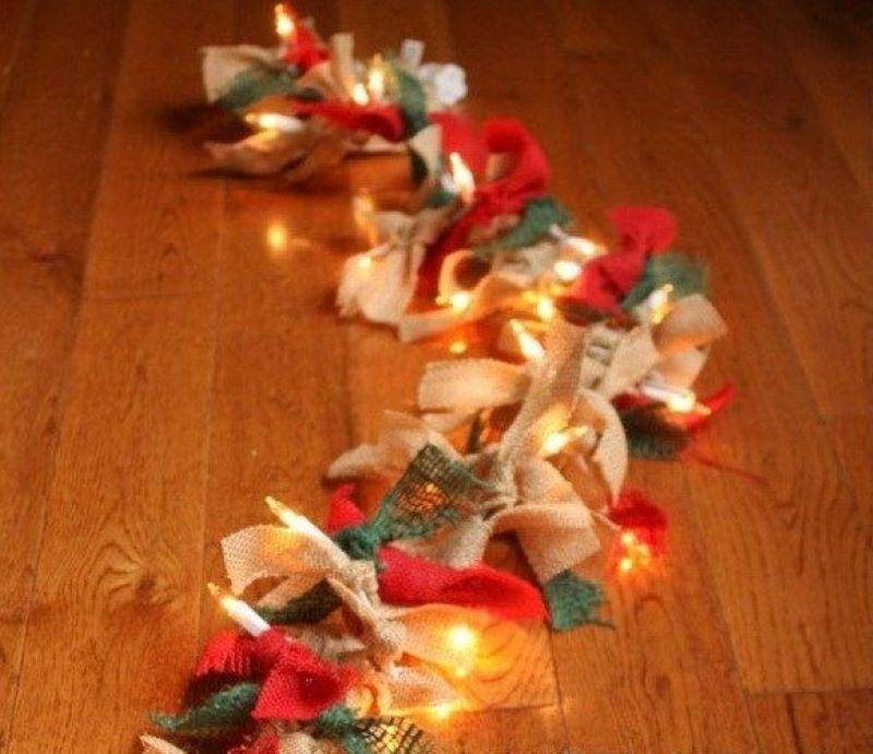 Christmas lights on a table with burlap wrapping.