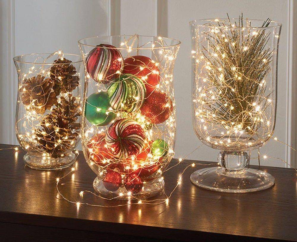 Christmas lights inside a multiple glass vases.