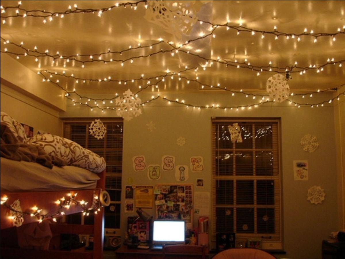 Room with white Christmas lights hanging on the ceiling.