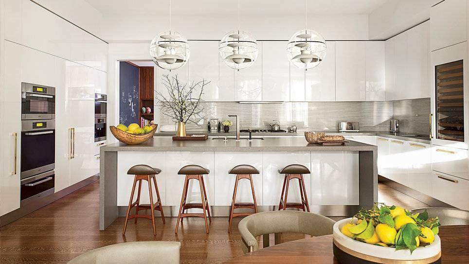 Modern kitchen with wooden stools.