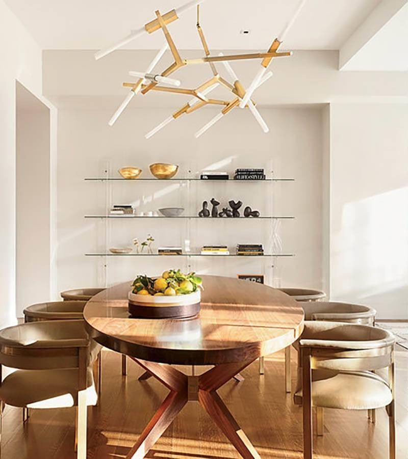 Modern dining room with wooden table and chairs.