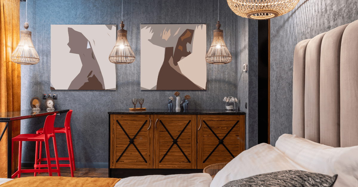 Bedroom with wall art and red chair.