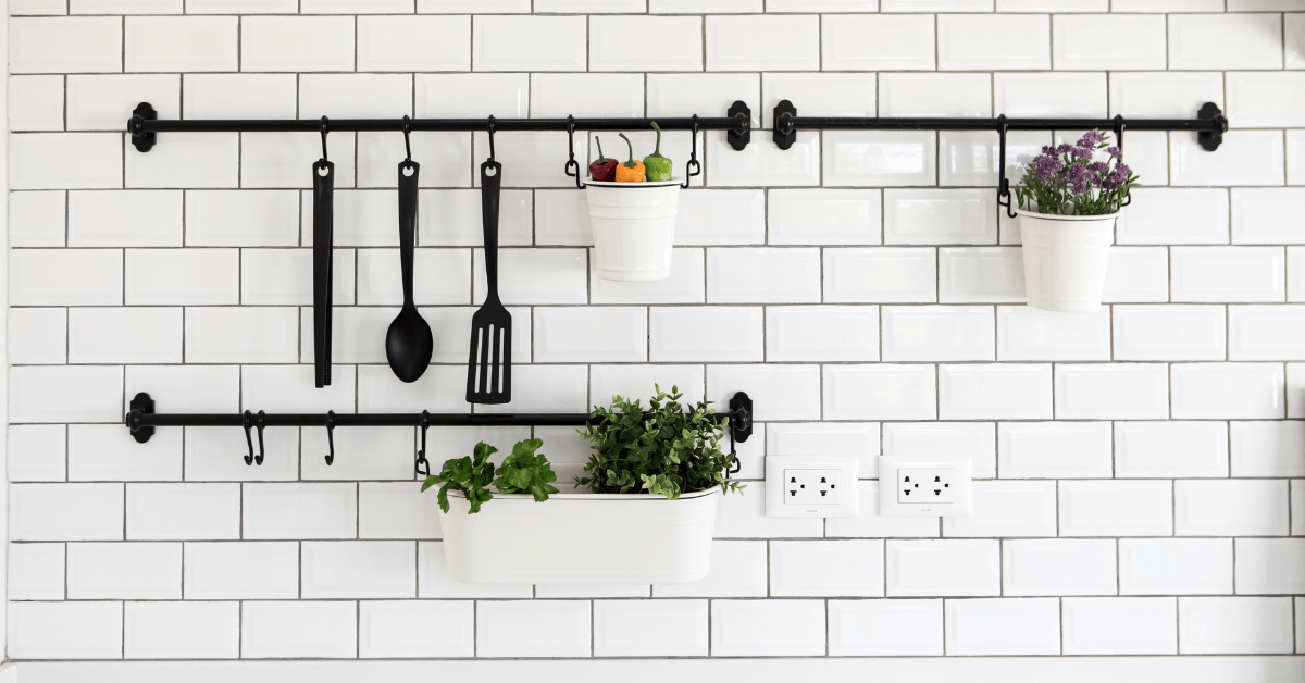 Closeup of kitchen white tile and grey grout.