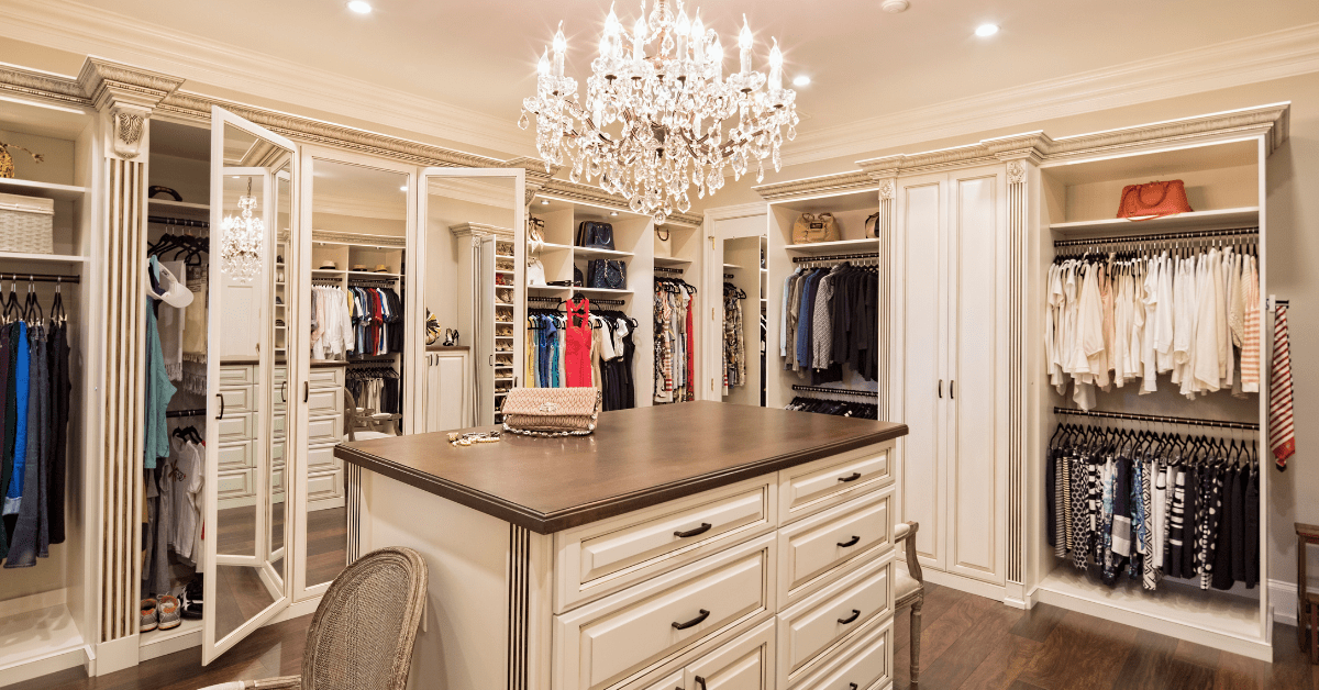 Stylish closet with an island in the middle.