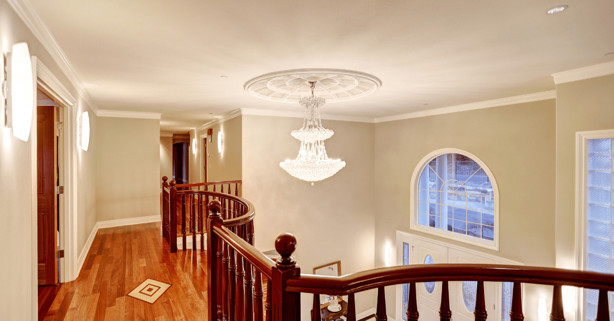 Large chandelier in a staircase.