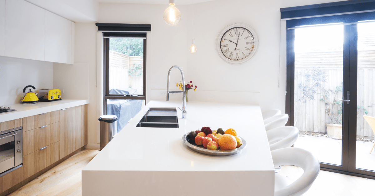 White kitchen with laminated cabinets.