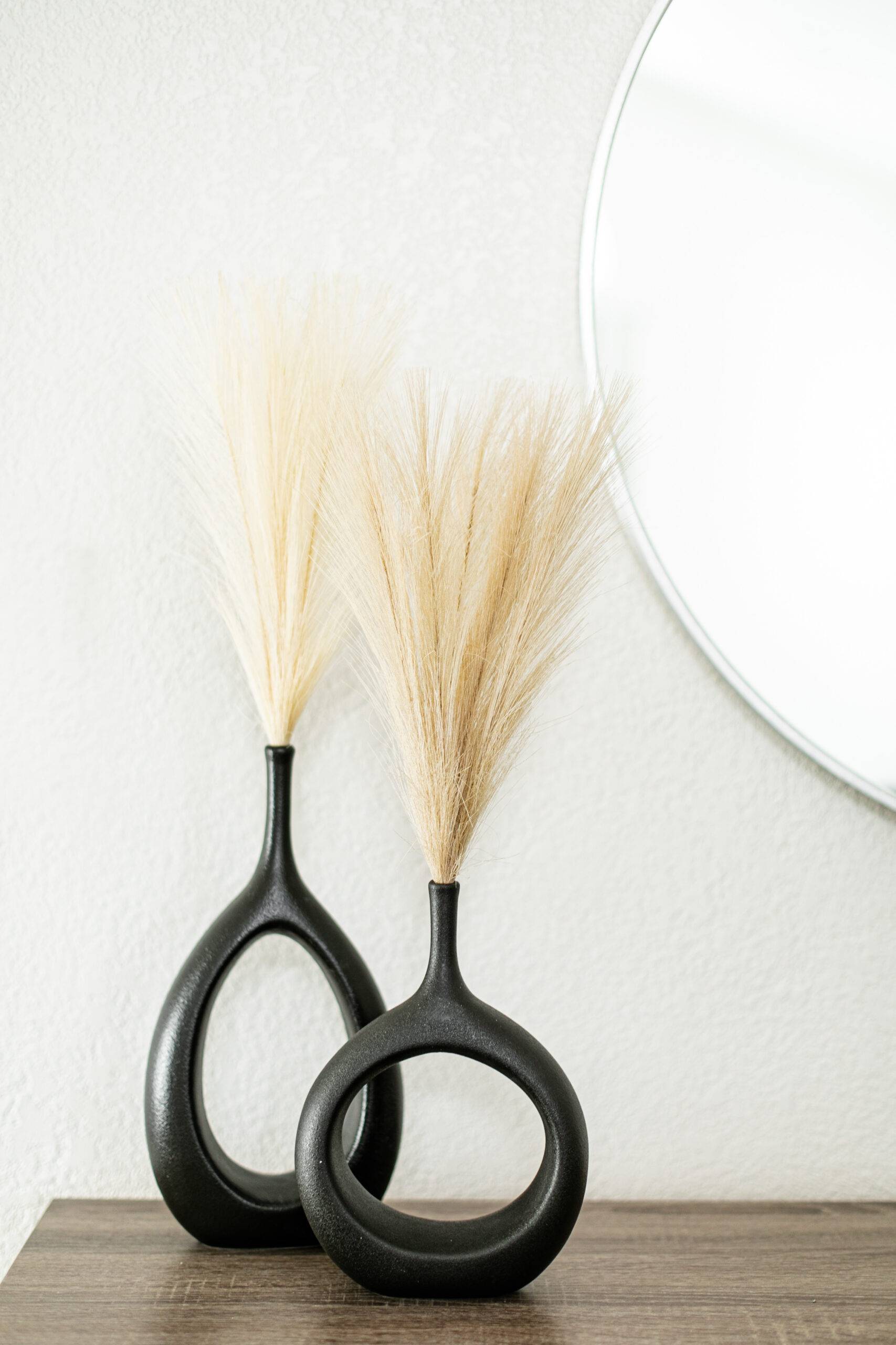 Pampas grass in modern black vases.