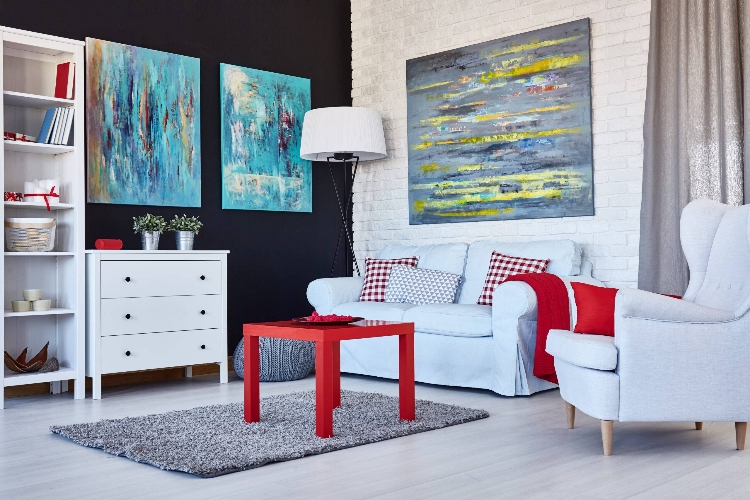 A modern living room with red accents.