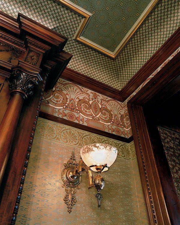 View looking up at the ceiling of a home, multiple wallpapers on the walls and ceiling.