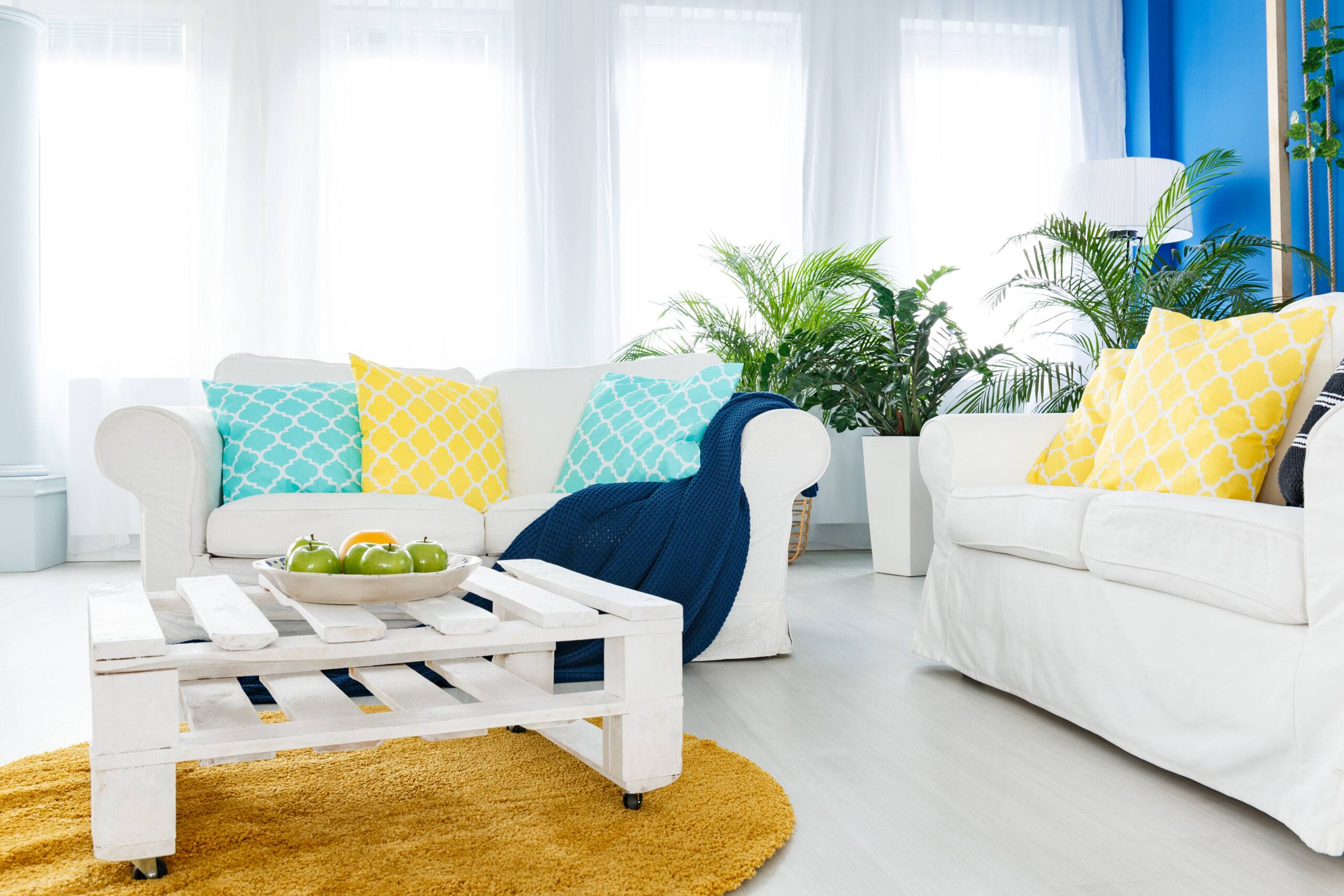 A bright living room with color accents.