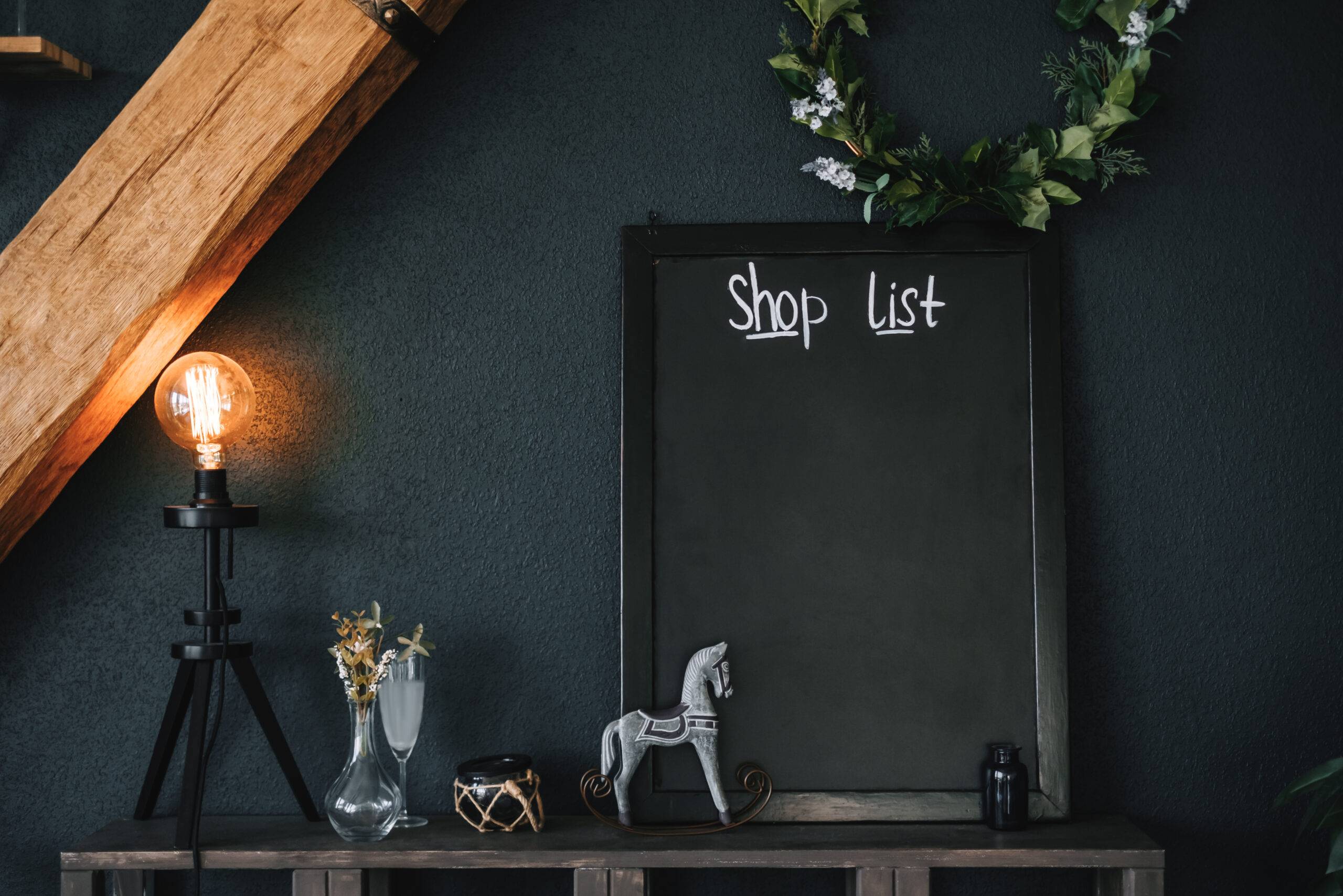 Black empty board in the kitchen for shopping list. Mock-up.