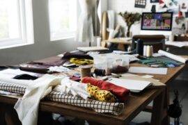 A table covered in various clutter.