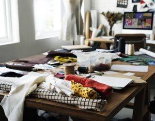 A table covered in various clutter.