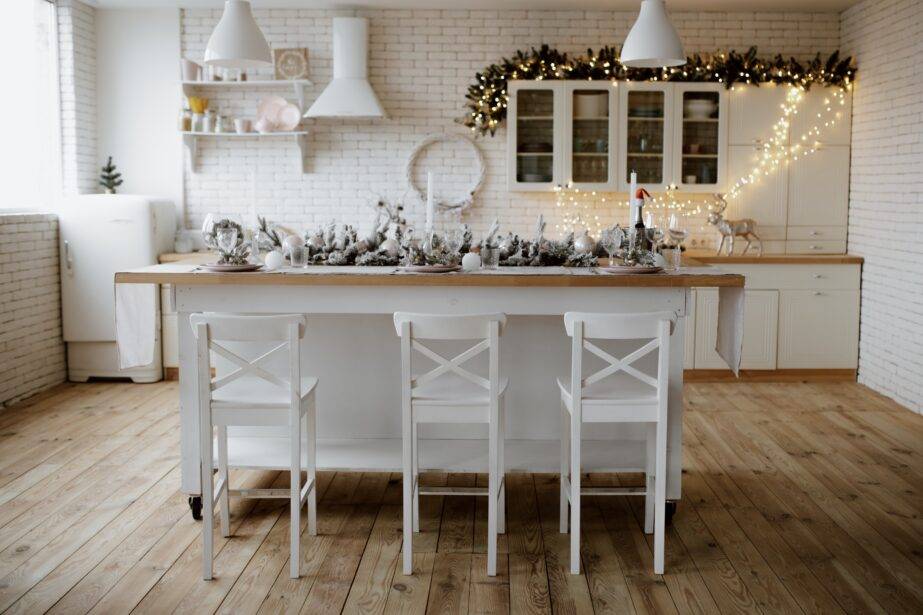 A white kitchen lightly decorated with winter decor.