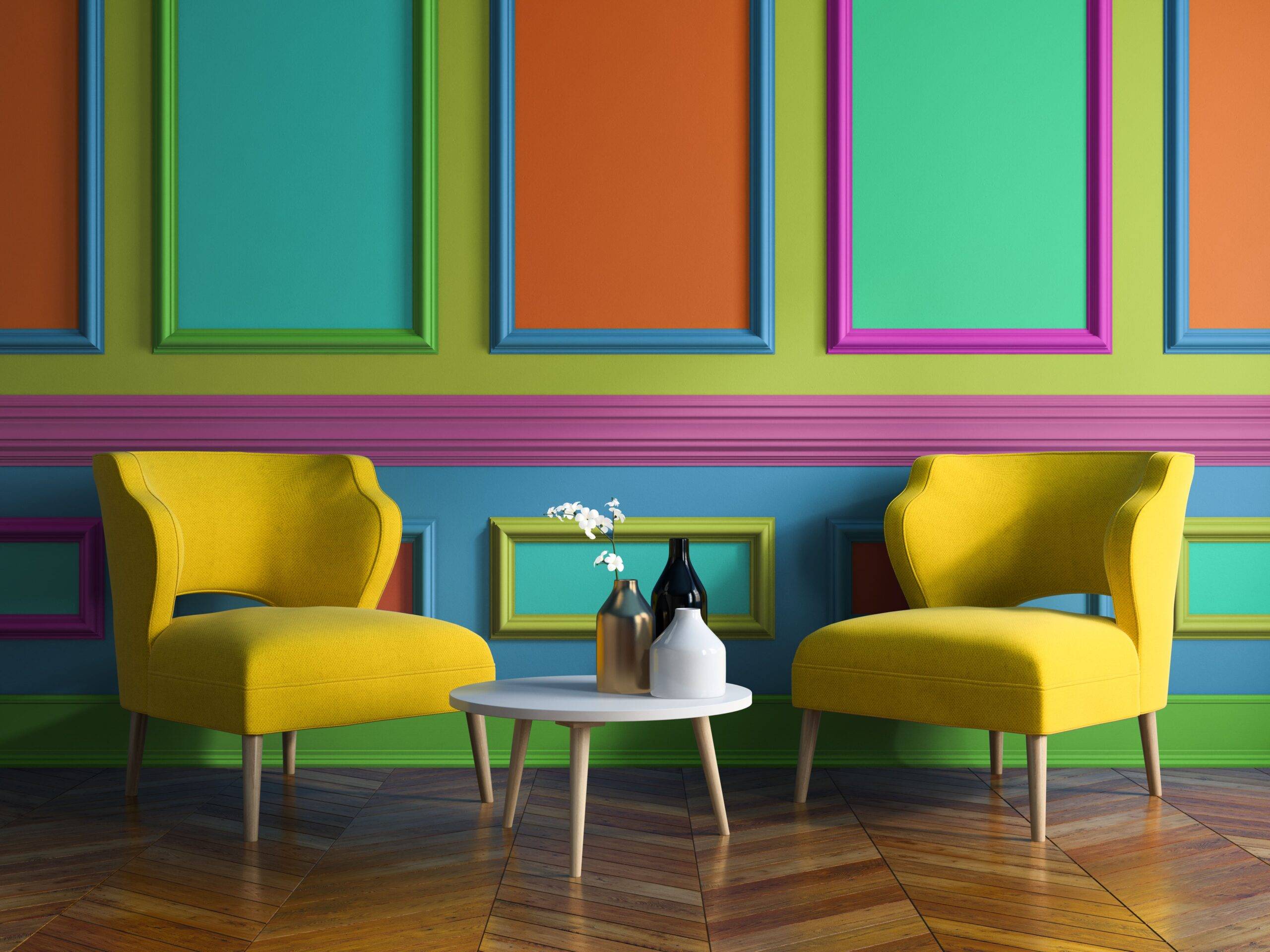 A bright, multi-colored wall with bright yellow chairs in front of it.