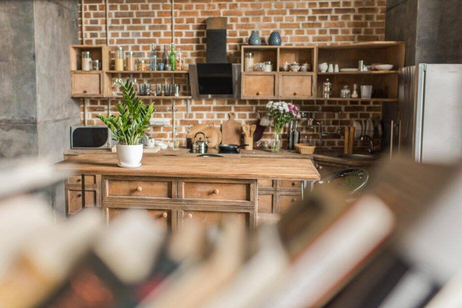 A rustic, old-style wooden kitchen as seen through an open shelf.