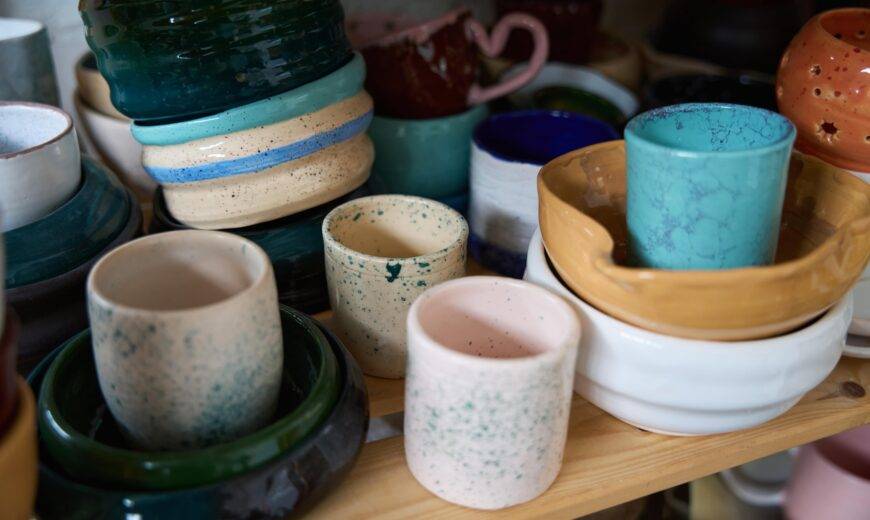 A selection of handmade ceramic cups and bowls.