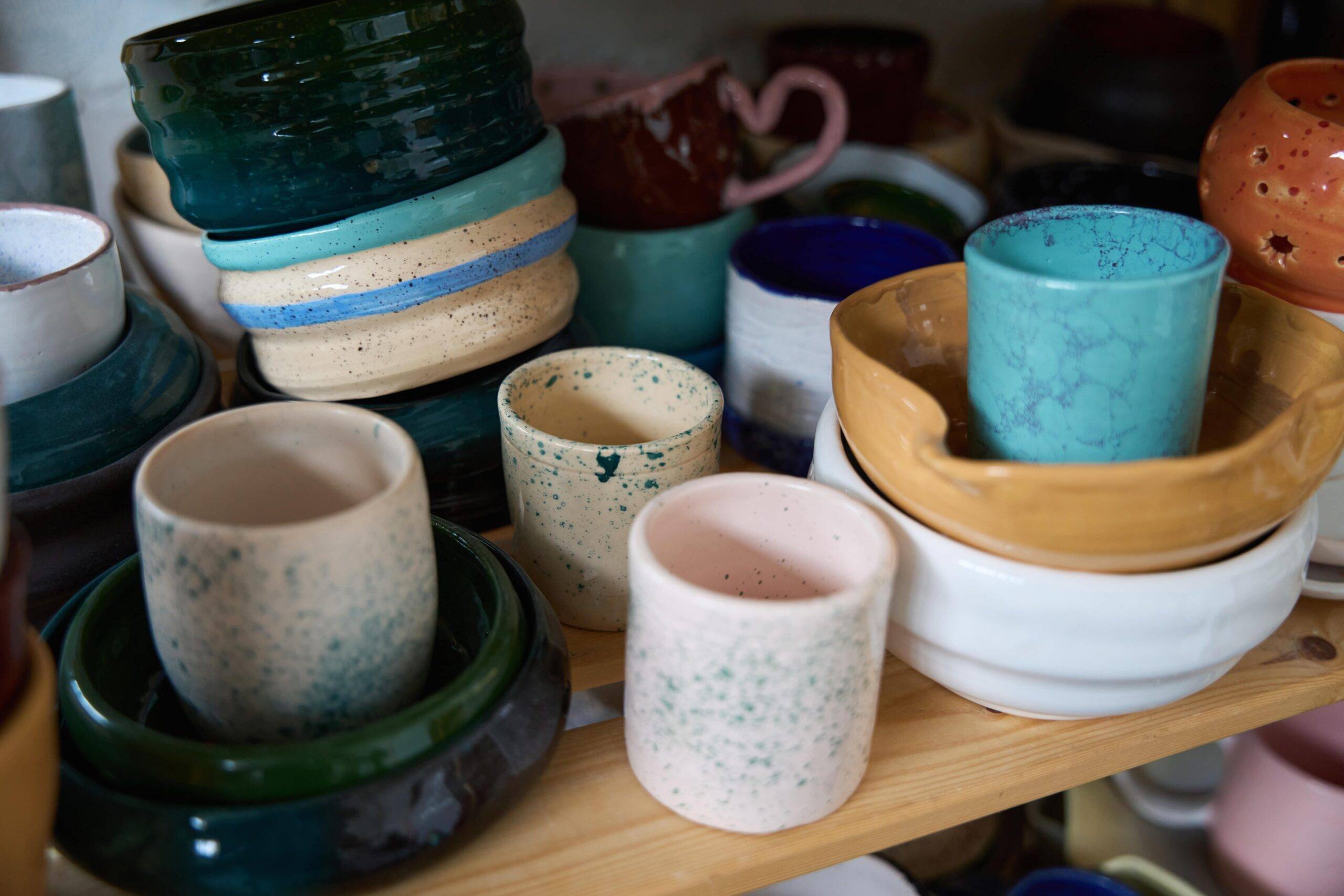 A selection of handmade ceramic cups and bowls.