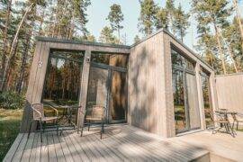 A modern-style tiny home with large windows.