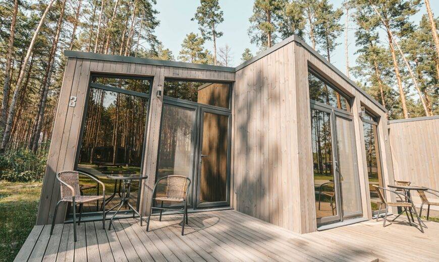 A modern-style tiny home with large windows.