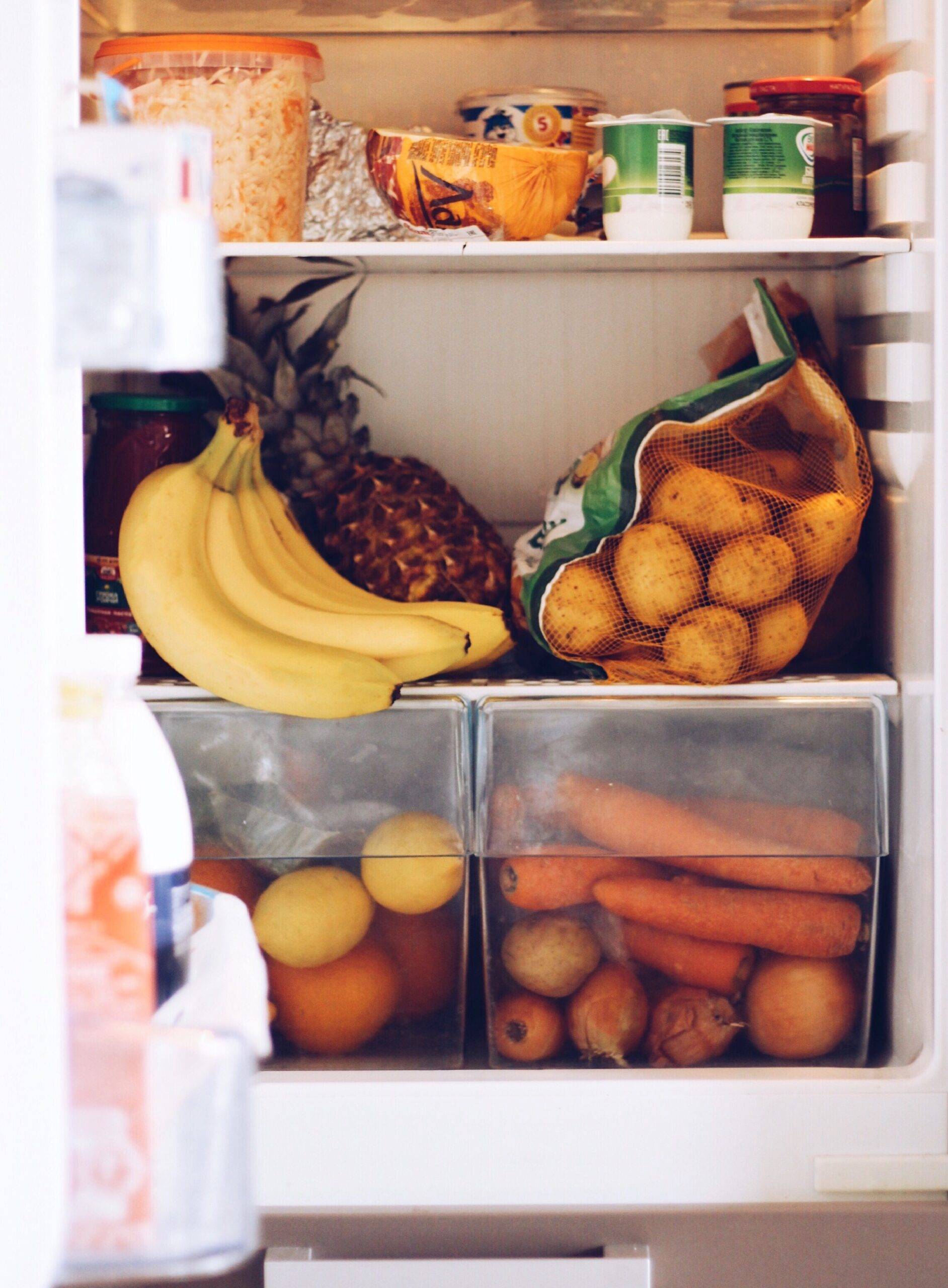 An open fridge full of food.