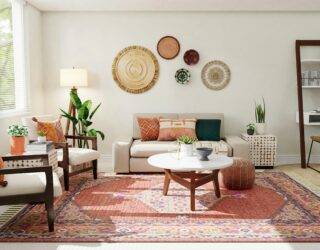 A light and bright living room with a large rug beneath the center.