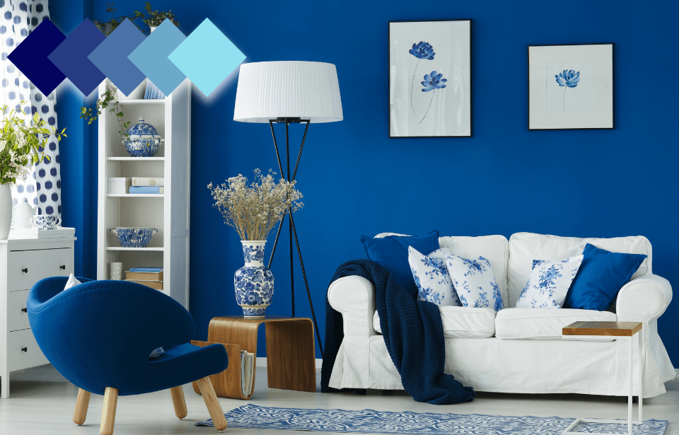 A monochromatic living room done up in blue and white. In the top left, there's a color wheel graphic showing a monochromatic color palette.