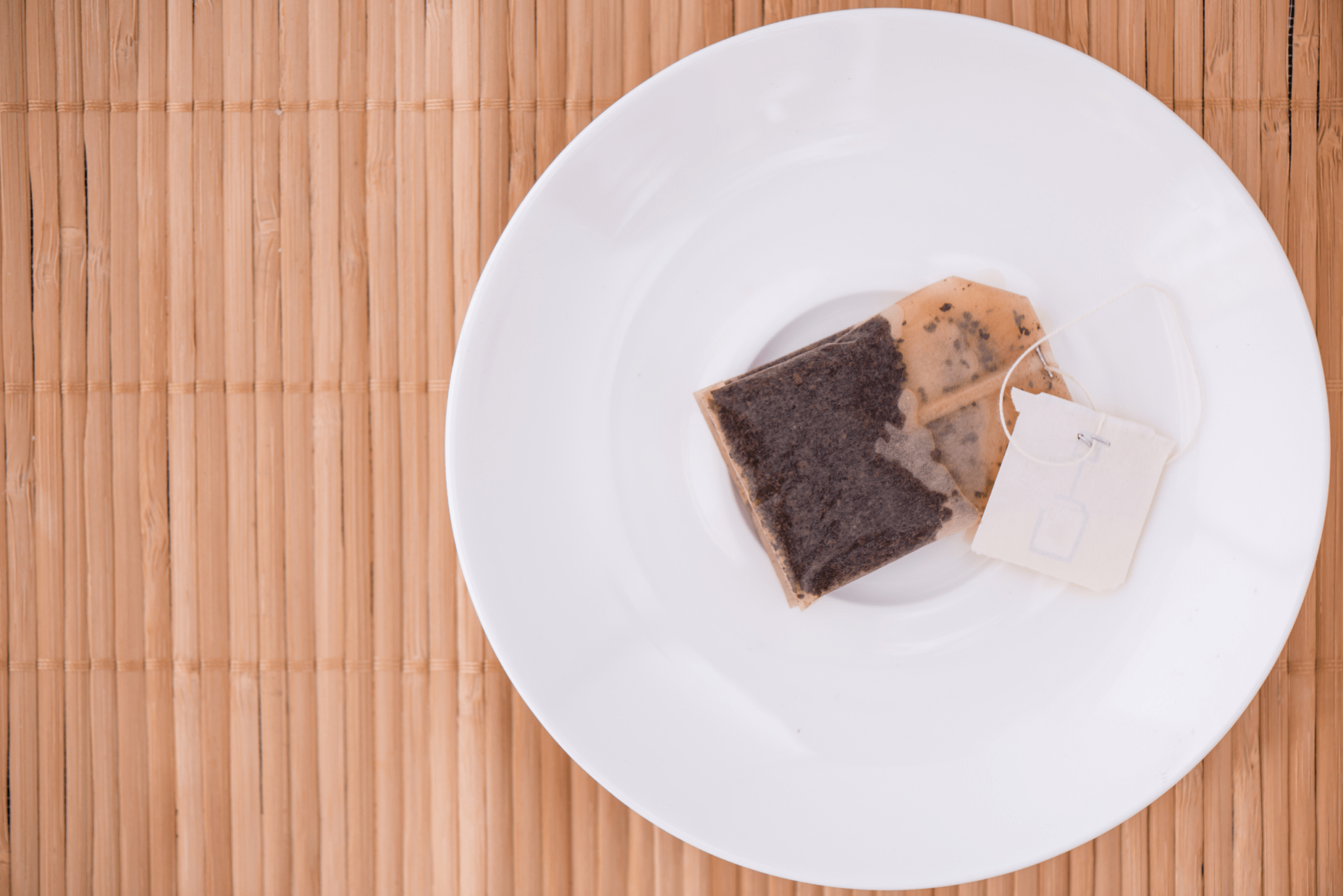 A used teabag on a plate.