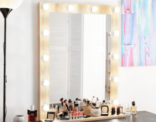 A makeup vanity with lights all around the frame.