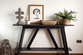 Entrance table covered in decor.