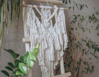 Macrame.Woman weaves home decor from cotton thread macrame pattern.Handmade in macrame technique.Creative hobby,eco friendly boho macrame decor. Mental health,home business,home decoration macrame