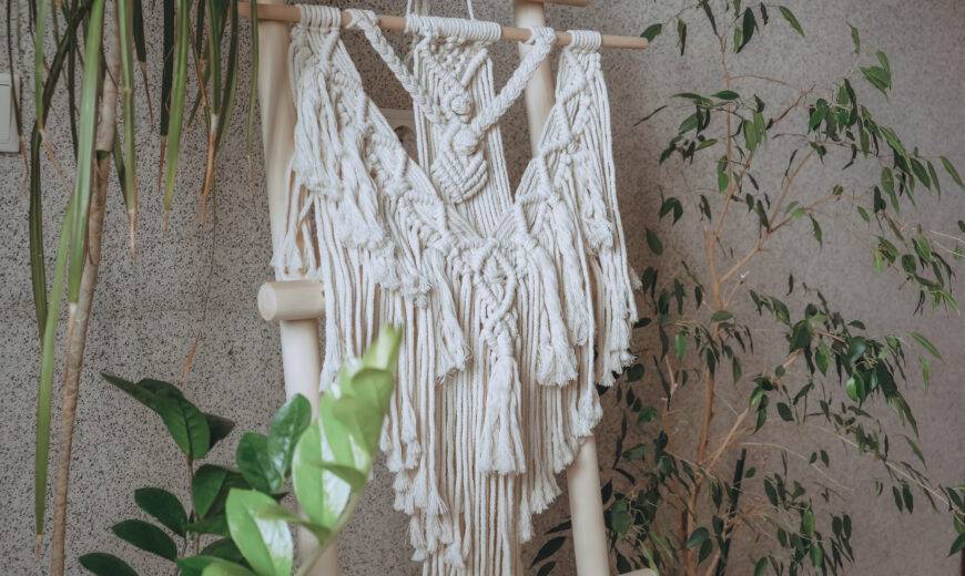 Macrame.Woman weaves home decor from cotton thread macrame pattern.Handmade in macrame technique.Creative hobby,eco friendly boho macrame decor. Mental health,home business,home decoration macrame