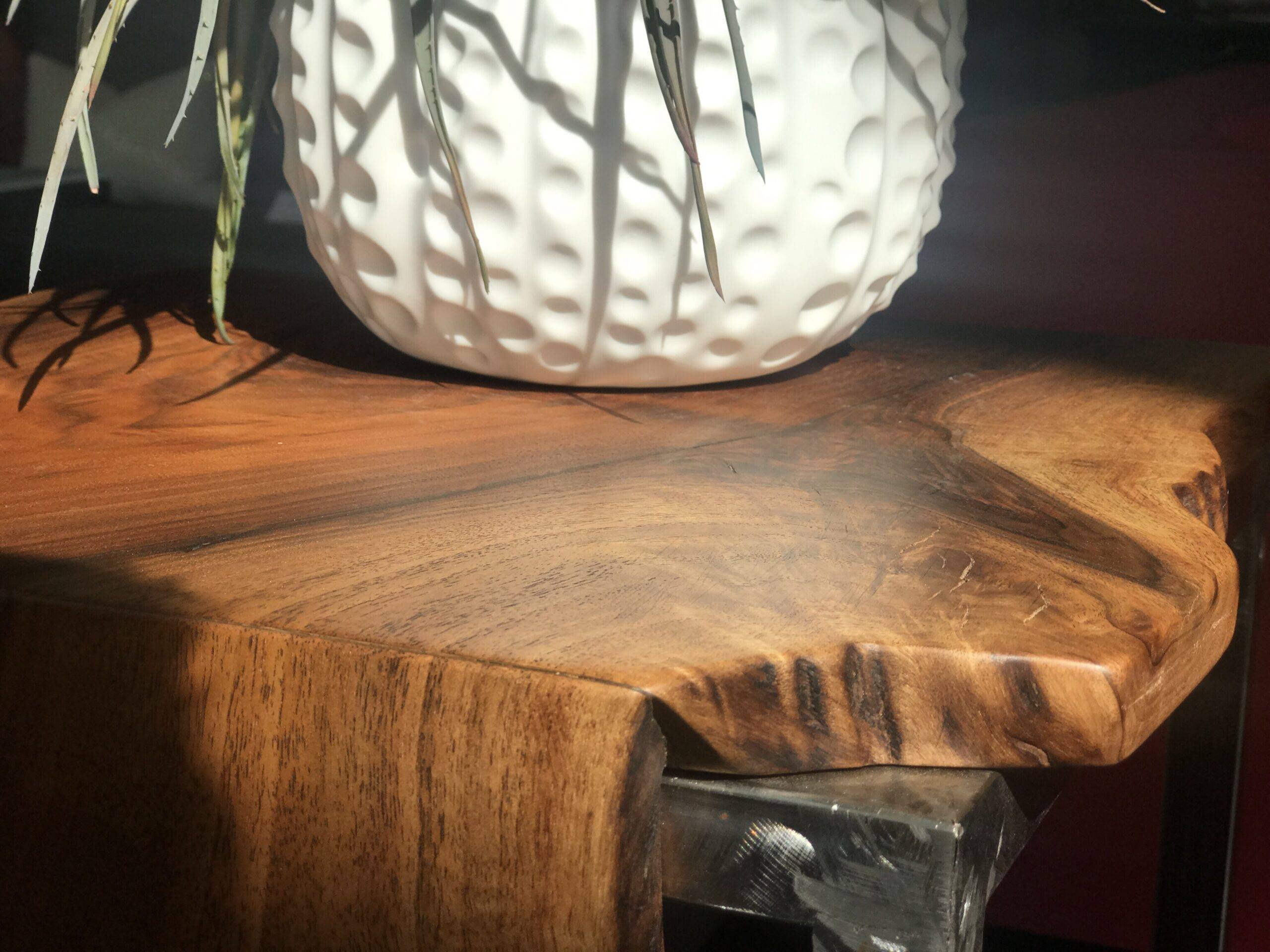 A live edge wood coffee table closeup.