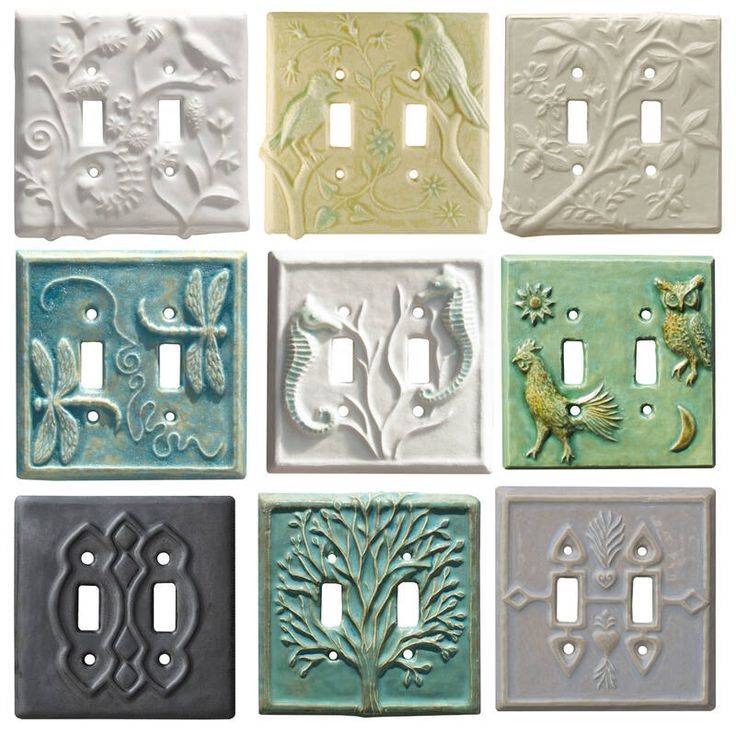 9 double light switch covers, all ceramic, with various colors and designs