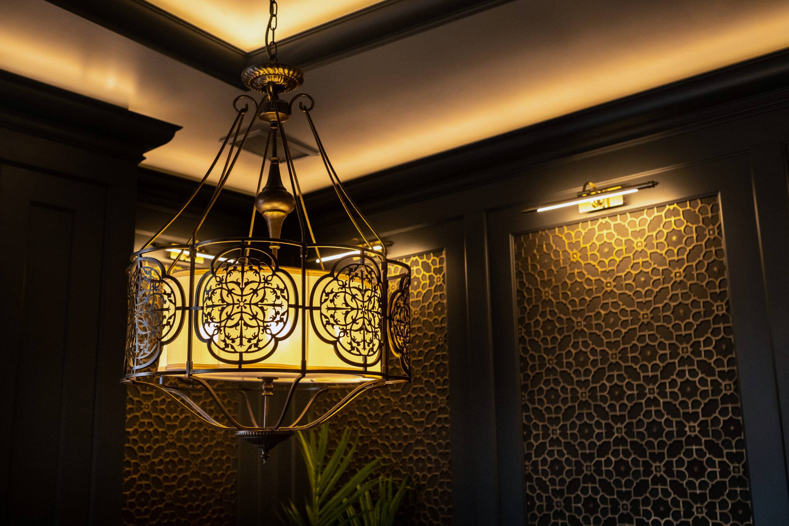 metal lamp in oriental style on the ceiling of the interior.