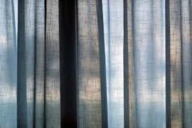 Semi transparent curtains against a window