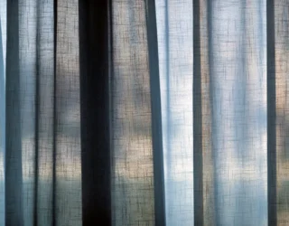 Semi transparent curtains against a window