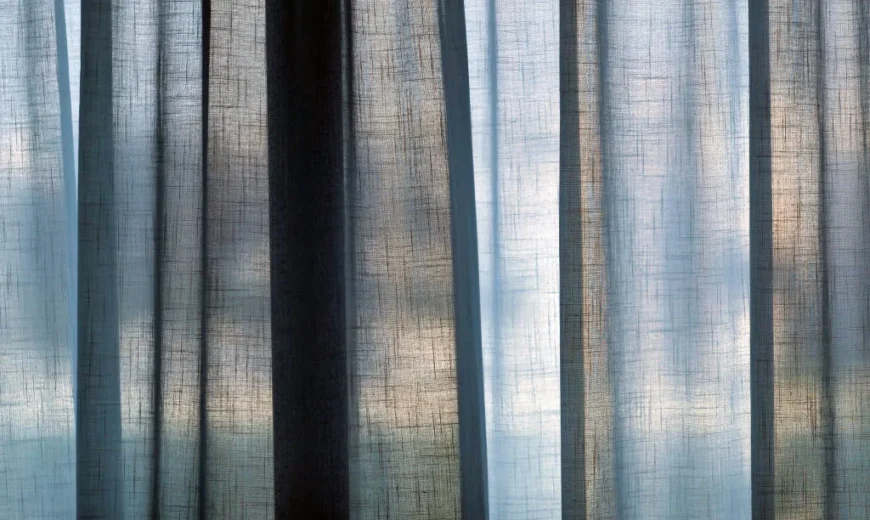 Semi transparent curtains against a window