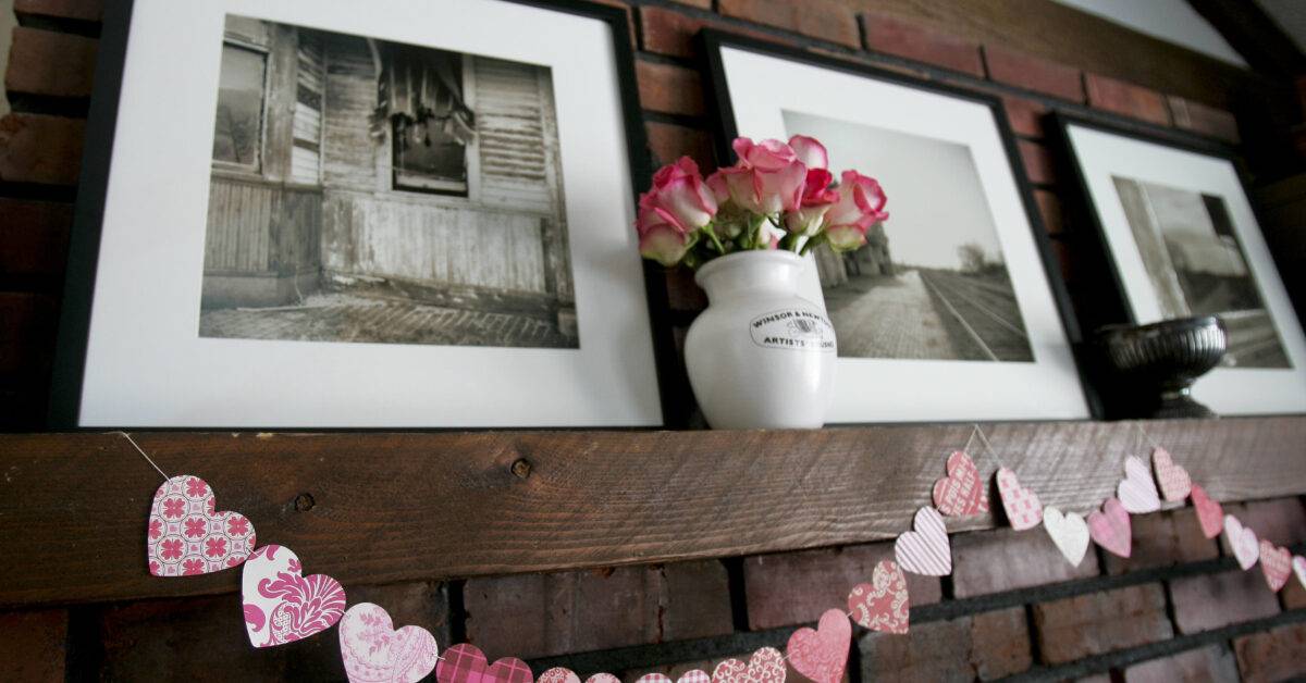 Michelle Spaw creates garland made from hearts to decorate her home for Valentine's Day.
