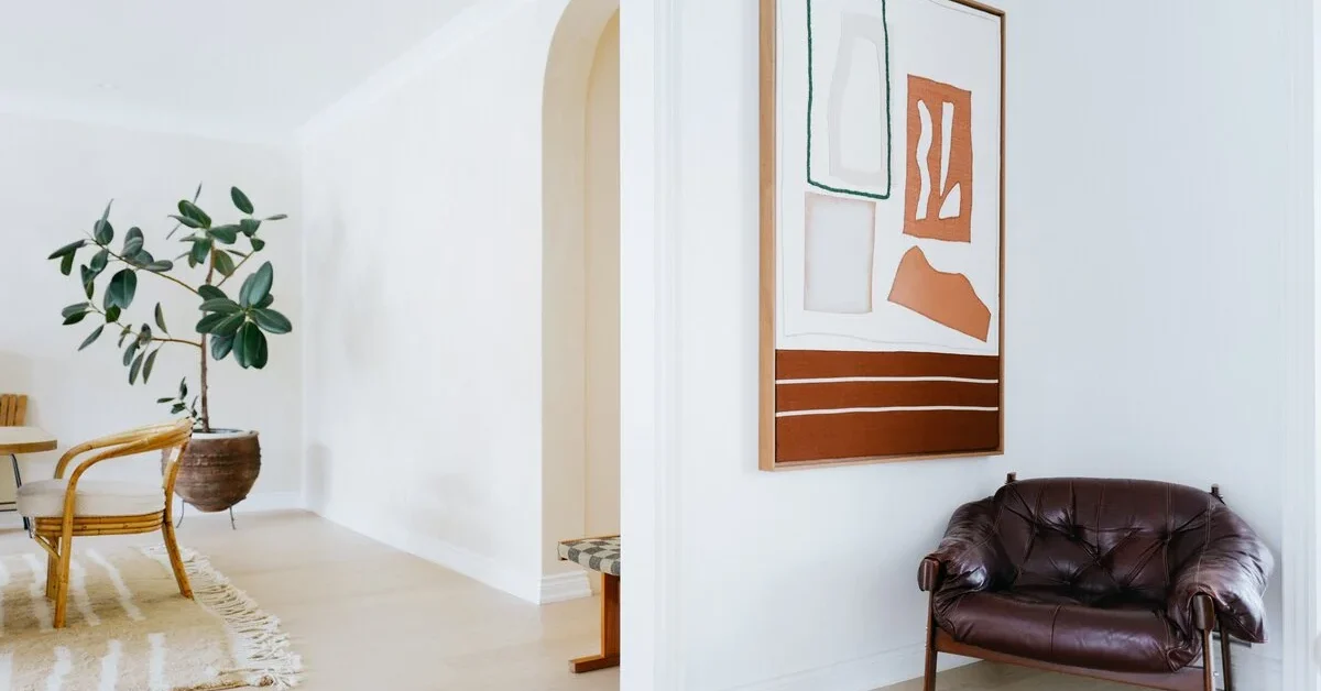 Unframed modern art used with some negative space on a wall.